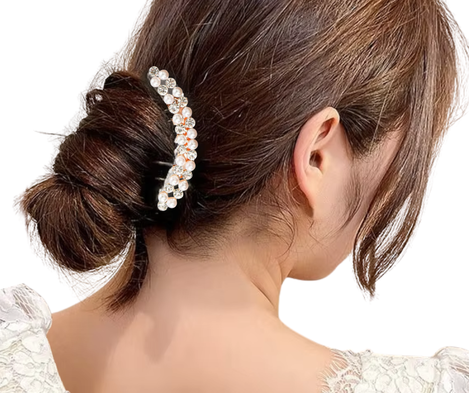 Woman with an updo bun wearing a decorative hair clip -bridal hair accessory