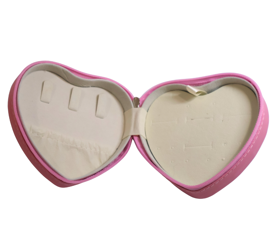 Heart-shaped pink jewellery box with beige interior on a white background