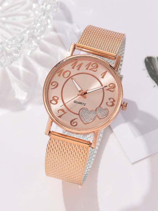 Rose gold watch with heart details on a white background