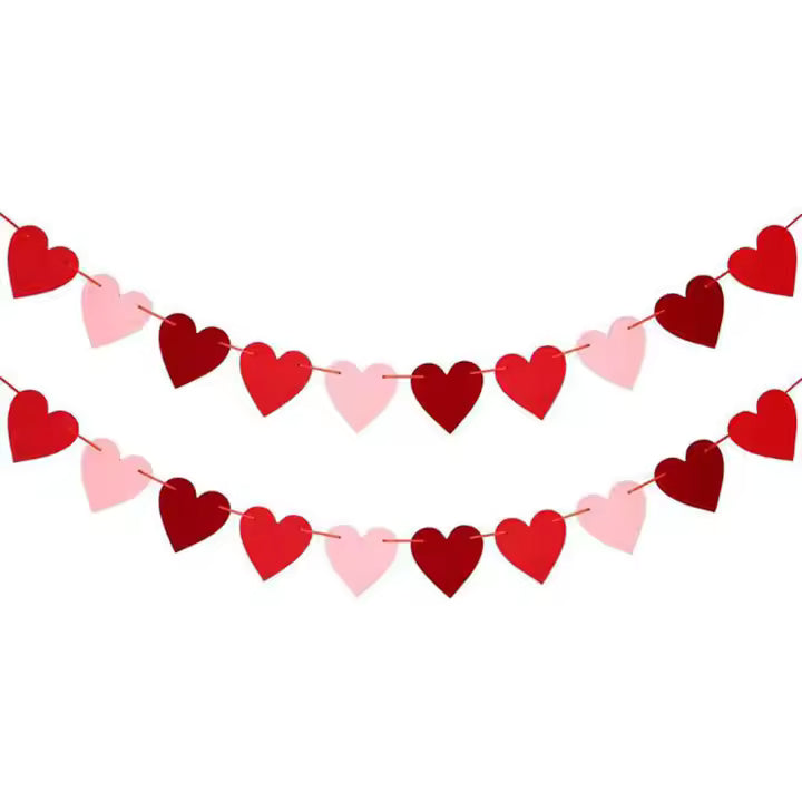 Heart-shaped banner with red and pink hearts on a white background