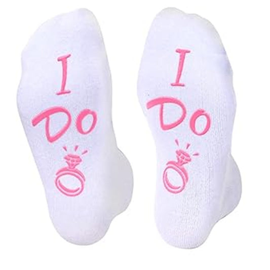 White socks with 'I Do' text and ring graphic on a white background