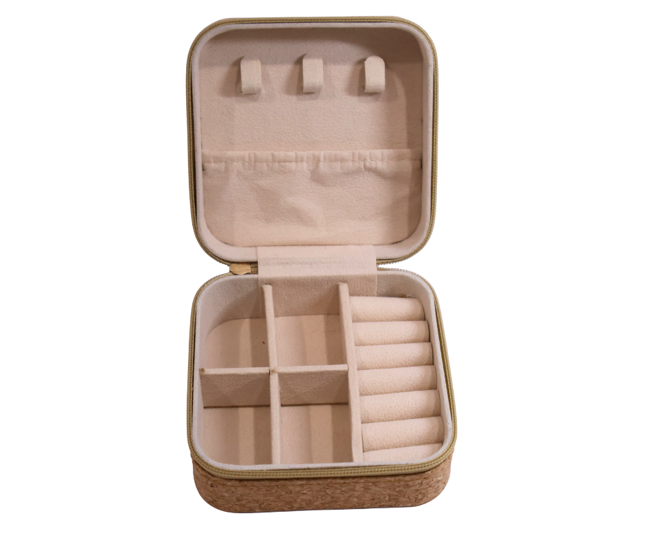 Cork jewellery case with compartments on a white background