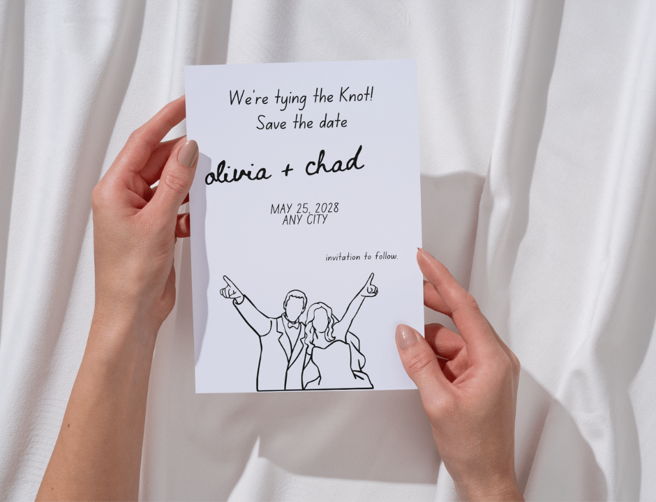 Hand holding a 'We're tying the knot! Save the date' card with a couple illustration against a white curtain background.