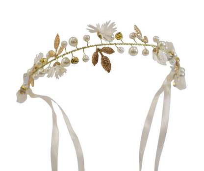 Floral headband with pearls and ribbons on a white background