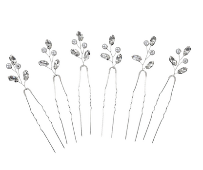 Set of silver hairpins with small crystals on a white background