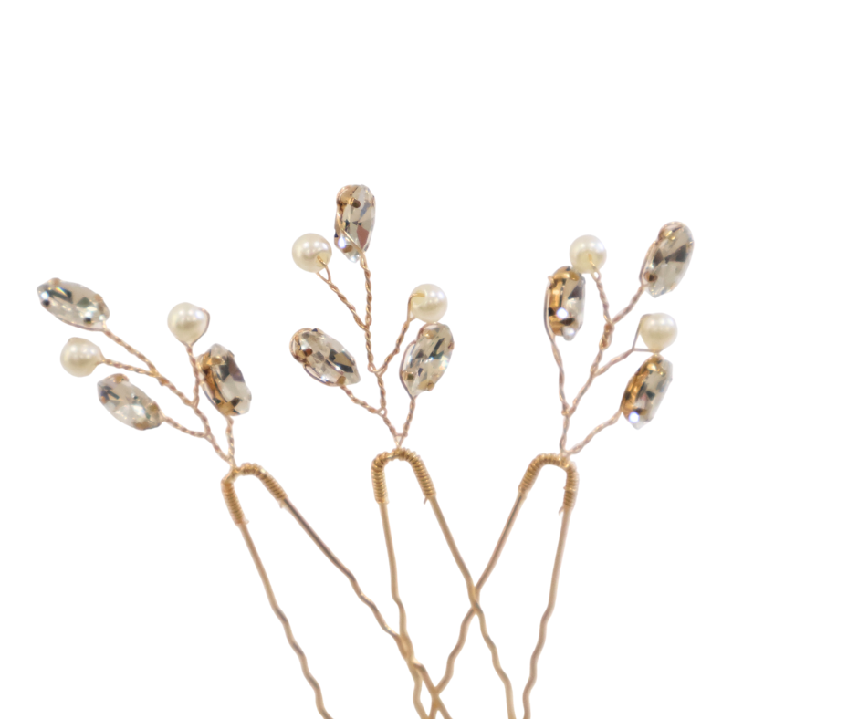 Decorative branch hairpins with small pearls and beads on a white background
