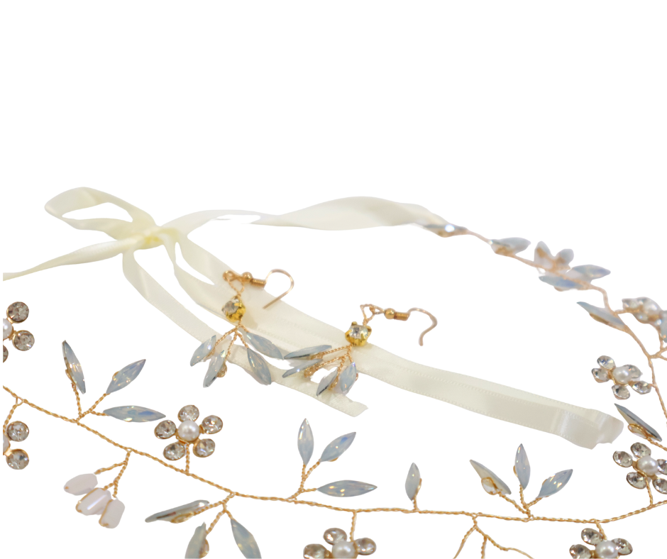 Floral headband with gold accents and matching earrings on a white background