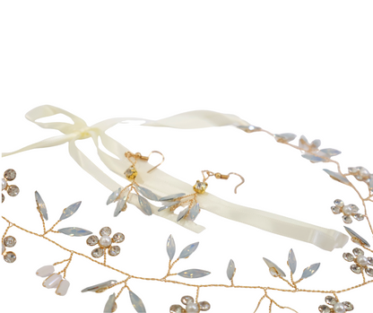 Floral headband with gold accents and matching earrings on a white background