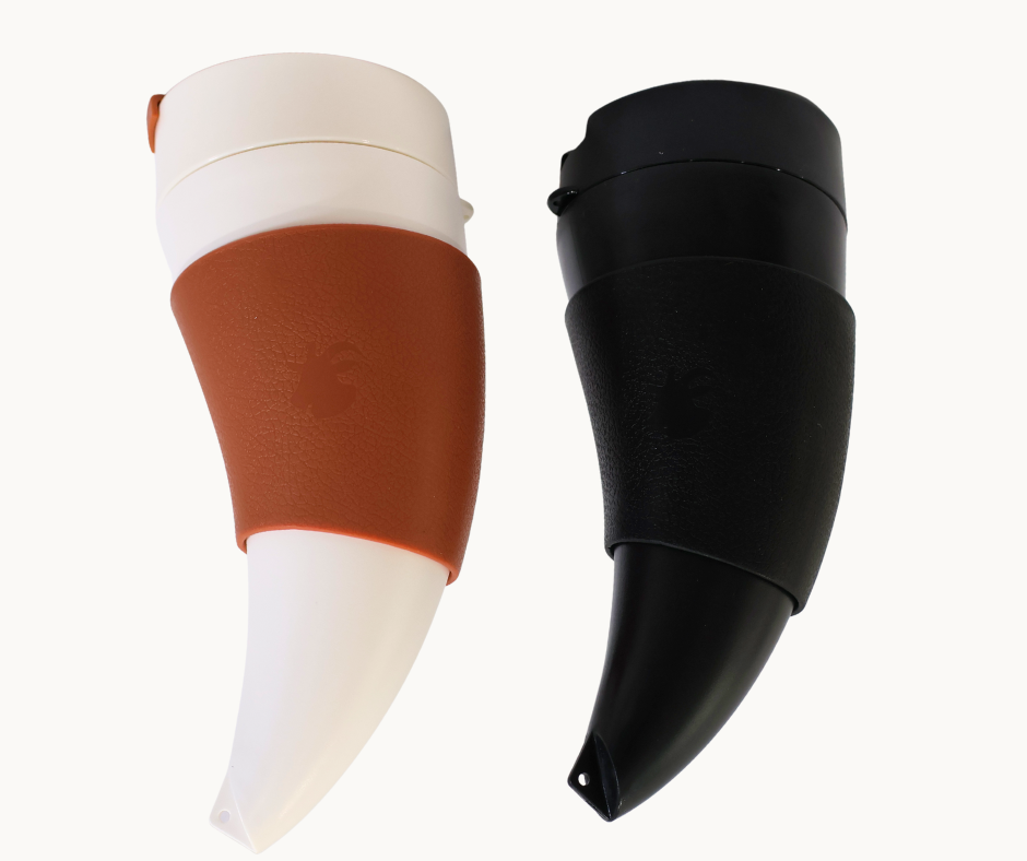 Two horn-shaped travel mugs, one white and brown, the other black, on a white background.
