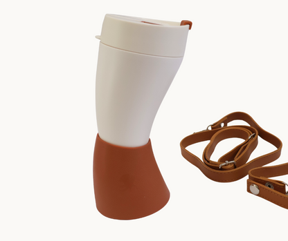 White and brown Viking inspired horn travel mug with a brown strap on a white background