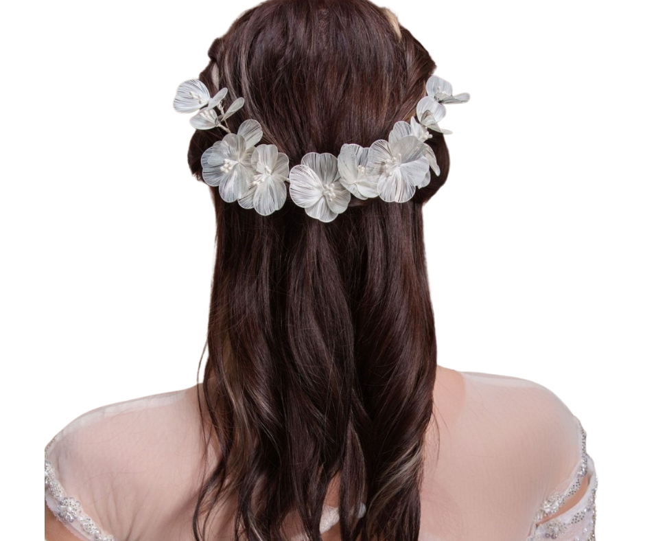 Bride with floral hair accessory on a white background