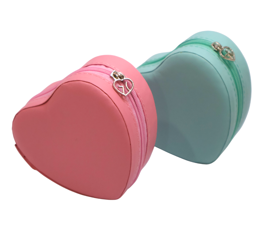 Pink and blue heart shaped jewellery cases with decorative zippers on a white background