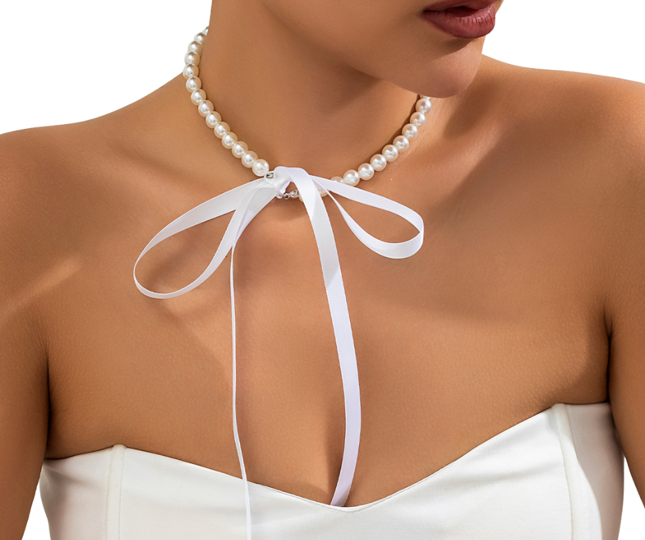 Faux Pearl choker with a white ribbon tied around the neck on a model - hens party accessory 