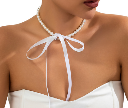 Faux Pearl choker with a white ribbon tied around the neck on a model - hens party accessory 