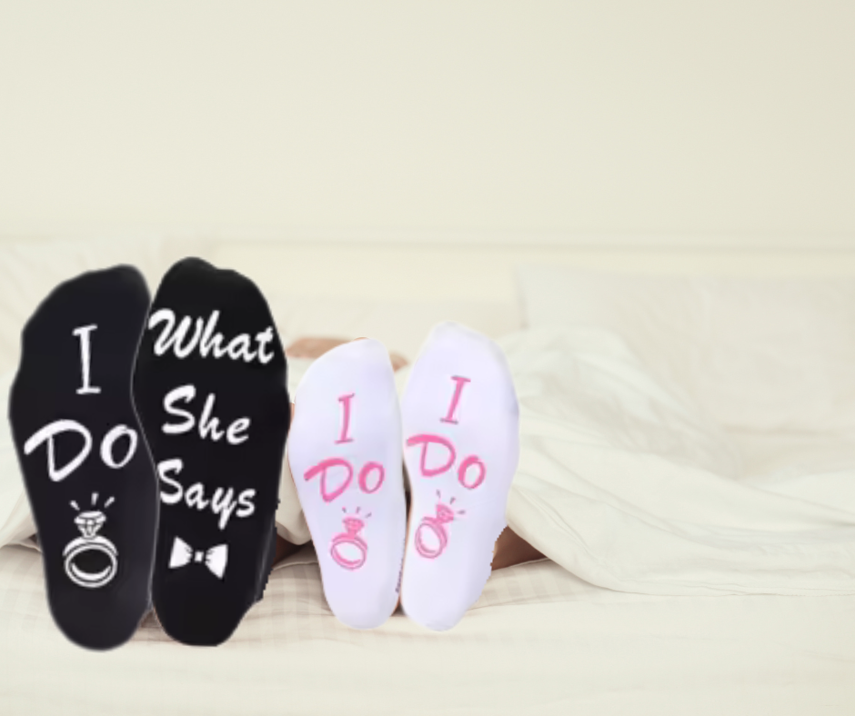 Two pairs of socks with 'I Do' and 'What She Says' text on a light background