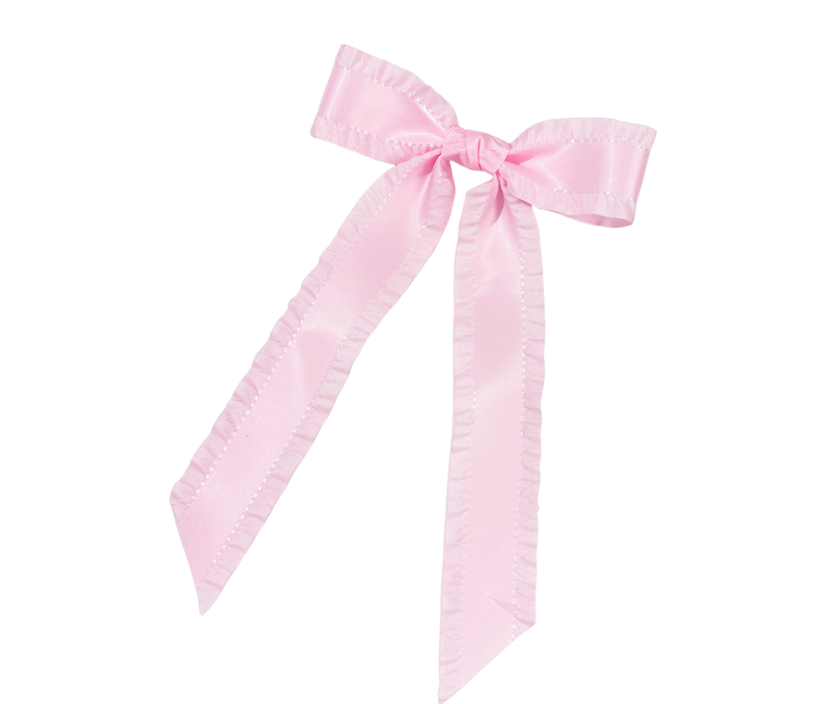 Pink bow hair clip on a white background