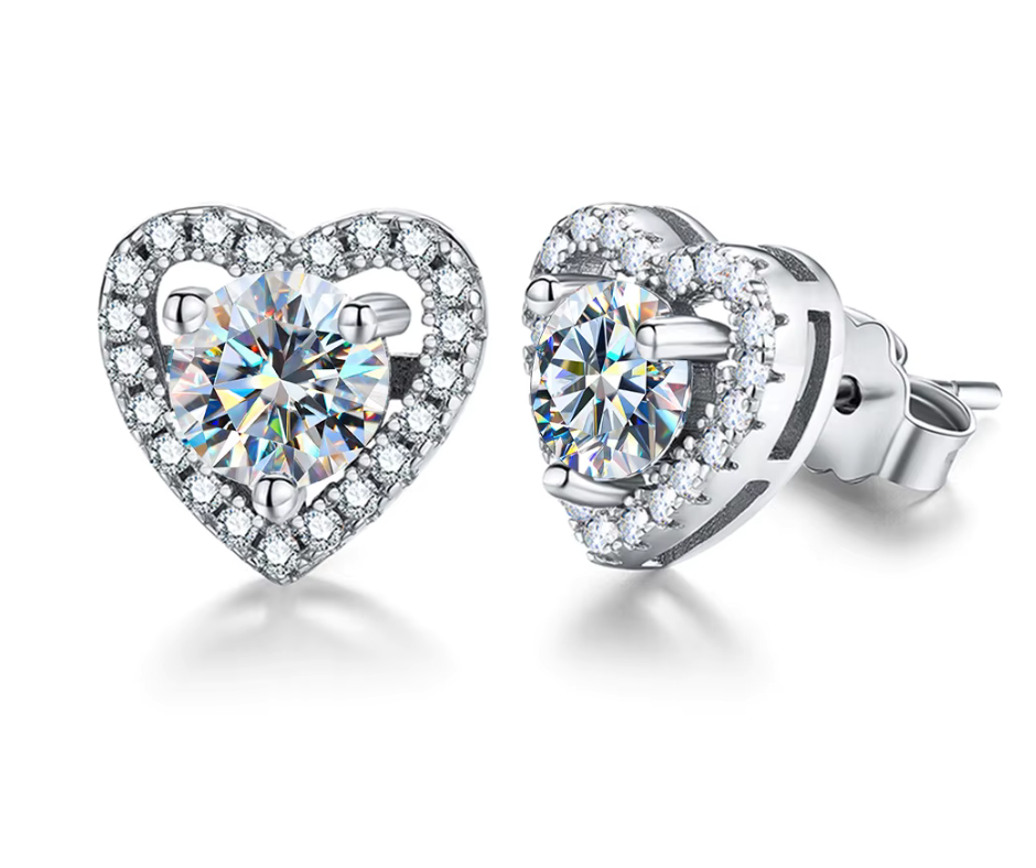 Heart-shaped moissanite stud earrings with clear gemstones on a white background