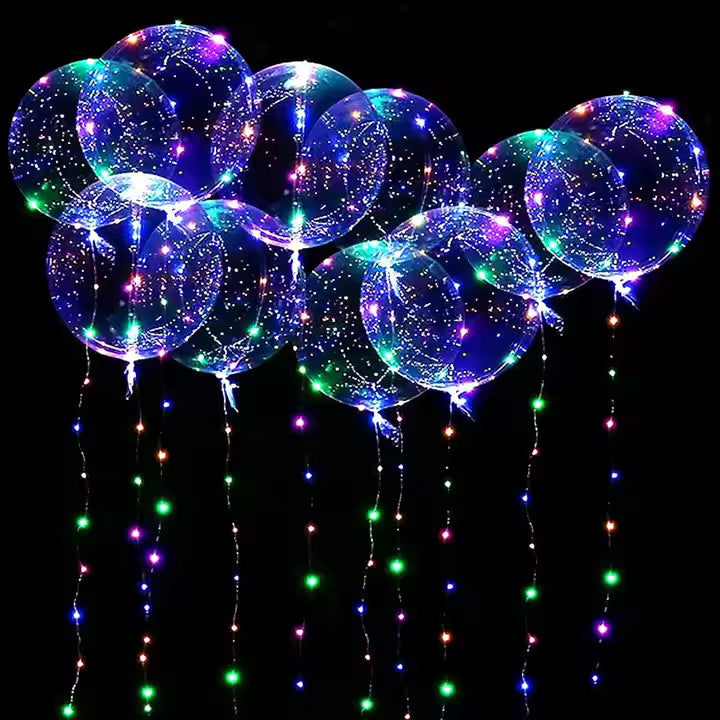 Colorful LED balloons with string lights against a black background