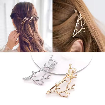 Hair accessories shaped like branches worn by a person with a white background.
