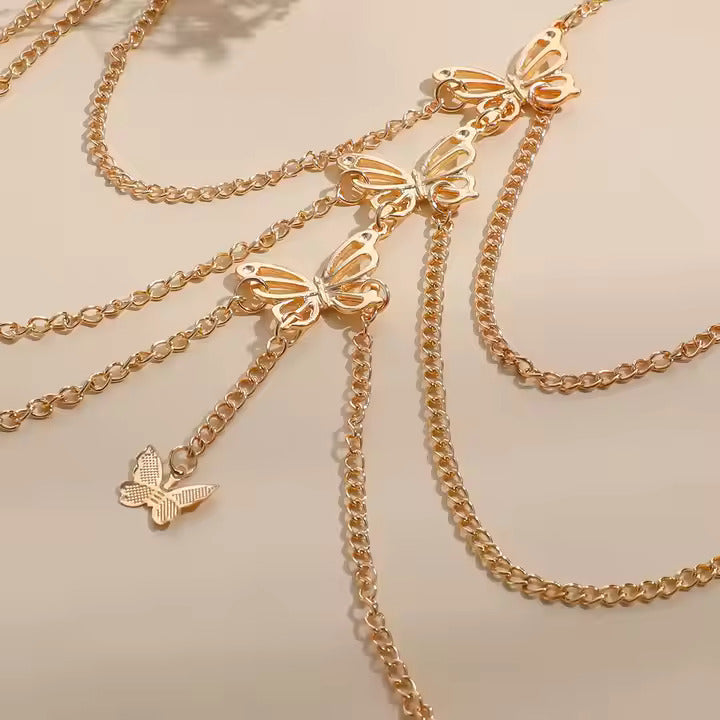 Gold butterfly garter on a beige background