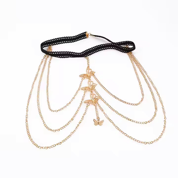 Gold chain garter with butterfly pendants on a white background
