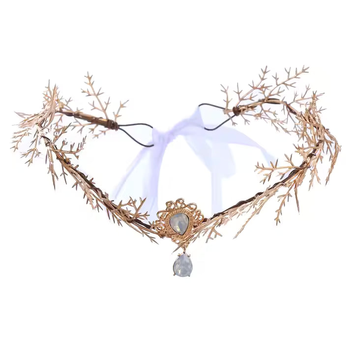 Decorative headband with gold branches and a central crystal on a white background