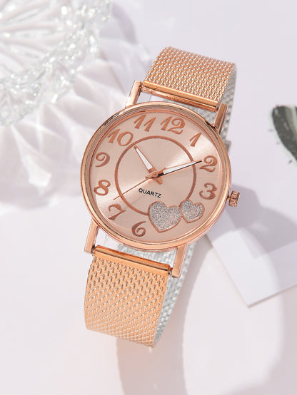 Rose gold watch with heart details on a white background