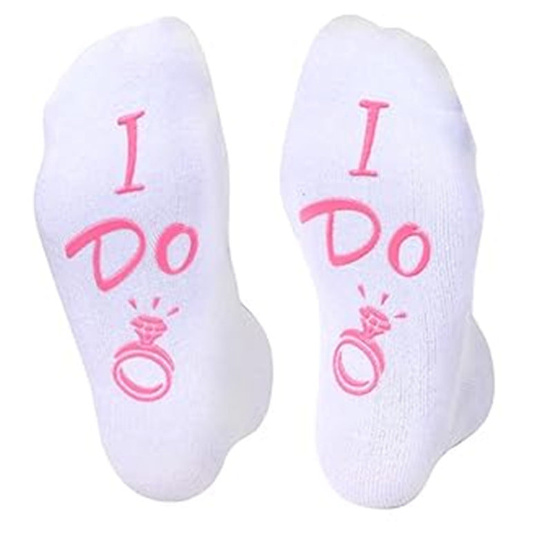 White socks with 'I Do' text and ring graphic on a white background