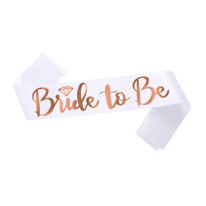 White sash with 'Bride to Be' text in rose gold on a white background
