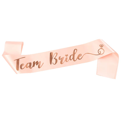 Pink sash with 'Team Bride' text and a ring icon on a white background