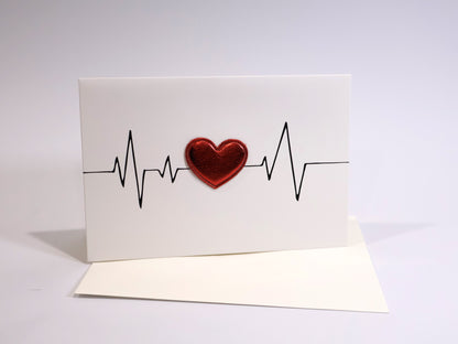 Card with a red heart and heartbeat line on a white background