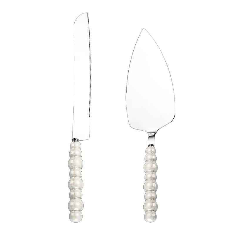 Cake server set with pearl handles on a white background