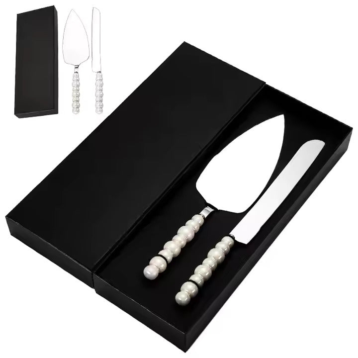 Stainless steel cake server and knife set with pearl handles in a black box.