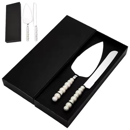 Stainless steel cake server and knife set with pearl handles in a black box.