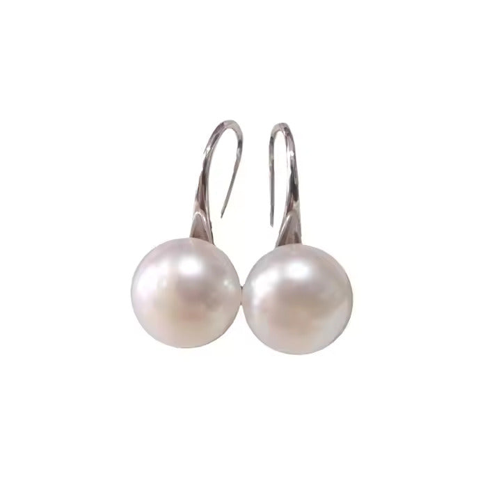 Pearl earrings on a white background
