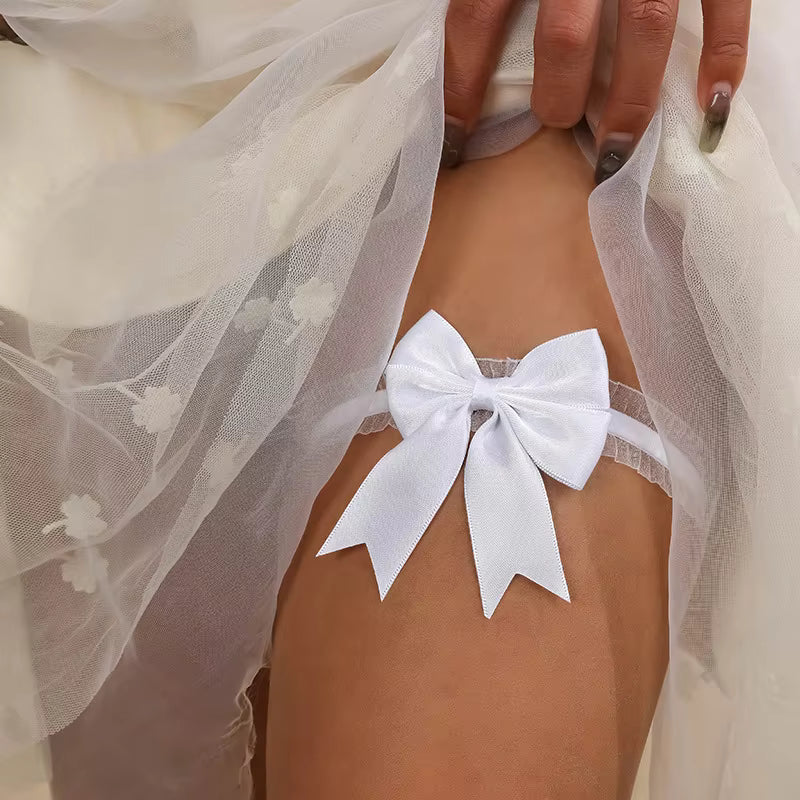 White lace bow worn by a bride