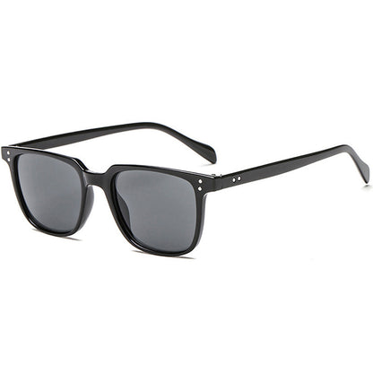 Black sunglasses with dark lenses on a white background