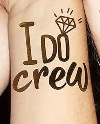 temporary tattoo on a person's arm with 'I Do Crew' and a diamond symbol.