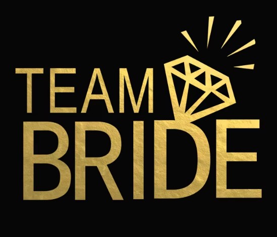 Gold 'Team Bride' temporary tattoo with a diamond icon on a black background