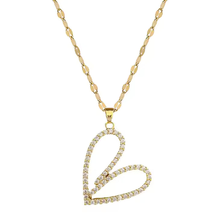 Gold necklace with a heart-shaped pendant on a white background