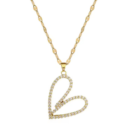 Gold necklace with a heart-shaped pendant on a white background