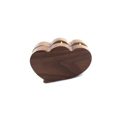 Wooden heart-shaped ring box on a white background