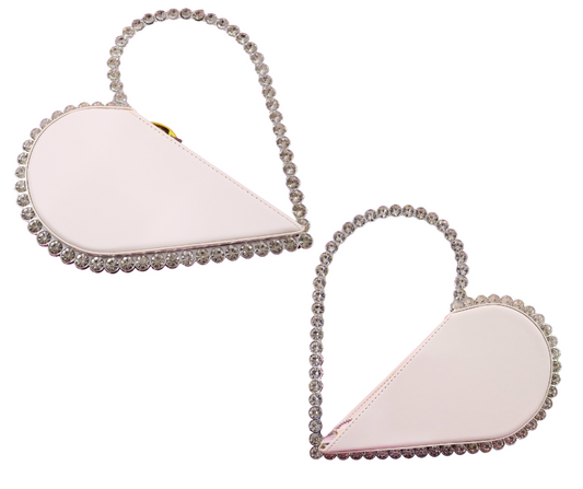 Heart-shaped clutch with rhinestone handle on a white background