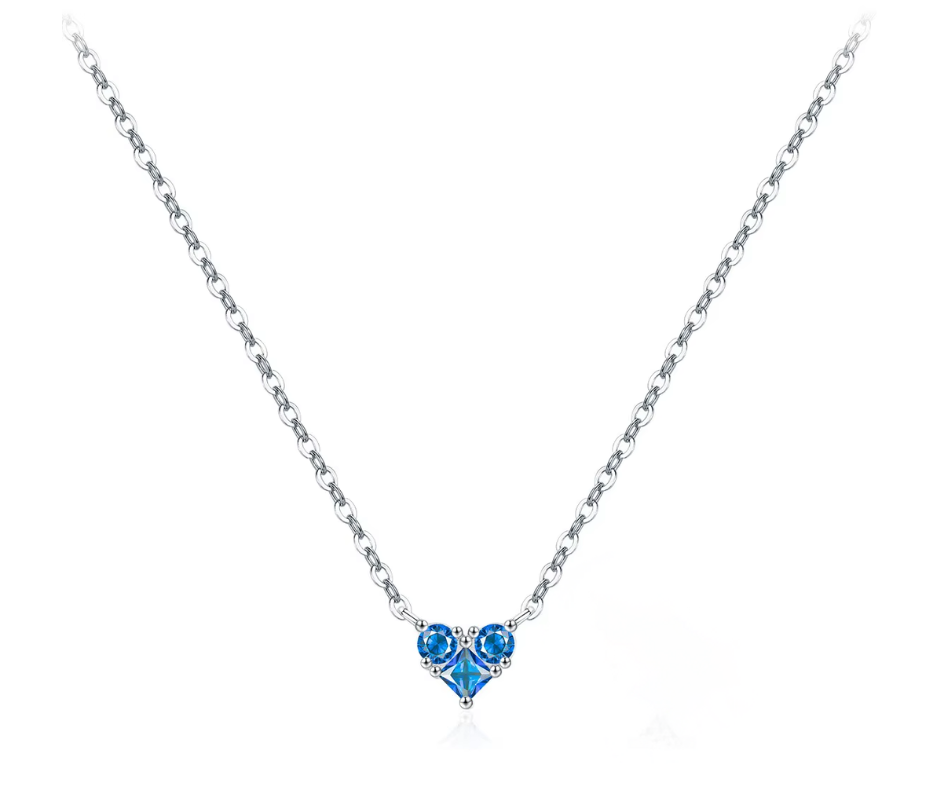 Necklace with a heart-shaped blue gemstone pendant on a white background