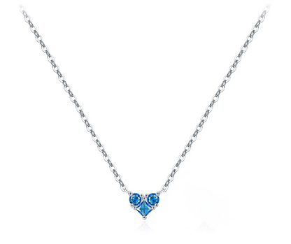 Necklace with a heart-shaped blue gemstone pendant on a white background