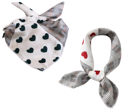 Two patterned scarves with heart designs on a white background