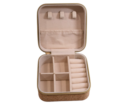 Cork jewellery case with compartments on a white background
