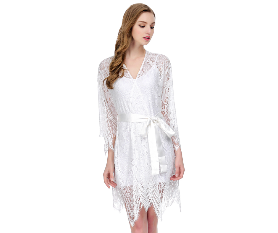 Bride wearing a white lace robe on a white background