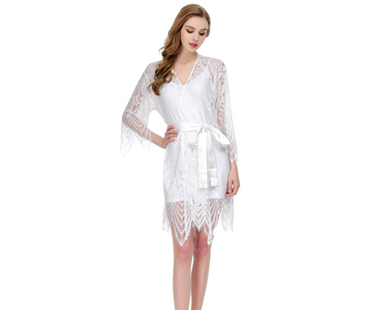 Woman wearing a white lace robe on a white background