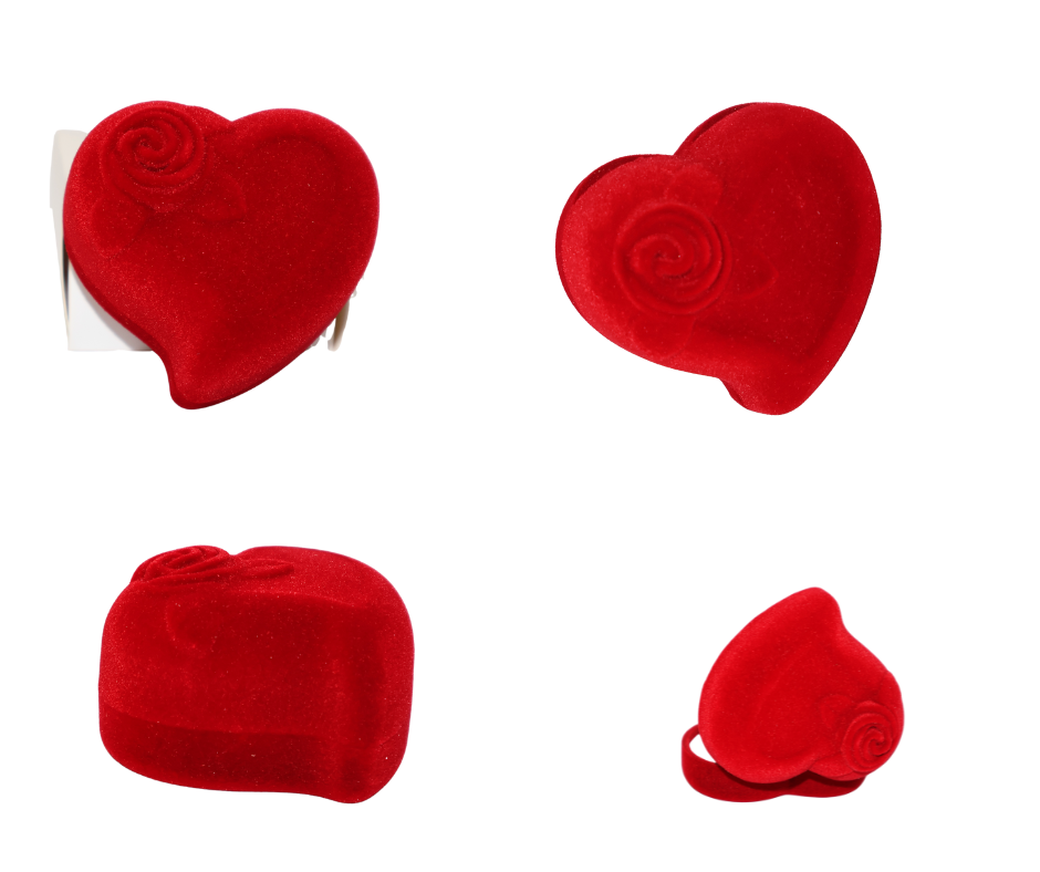Red heart-shaped velvet ring box with rose design on a white background
